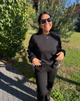 Pullover mit floraler Spitze an den Ärmeln in Schwarz