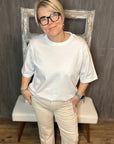 Stretch-Jeans mit weitem Bein in Creme