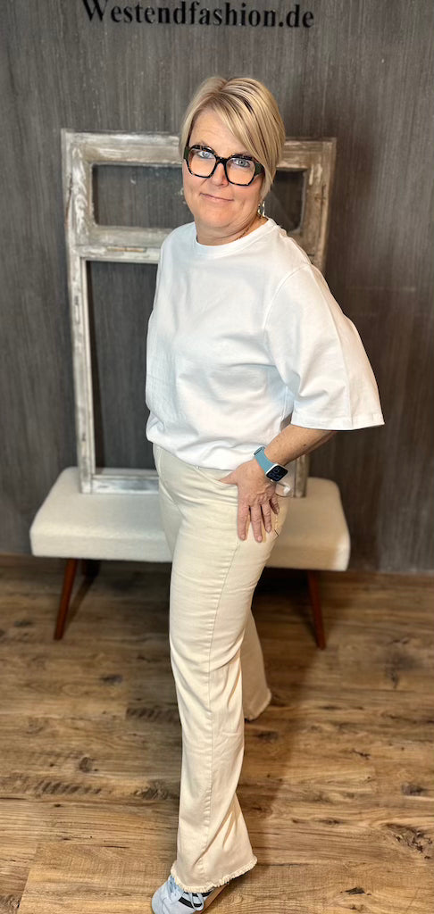 Stretch-Jeans mit weitem Bein in Creme
