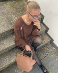 Grobstrickpullover mit engen Ärmeln